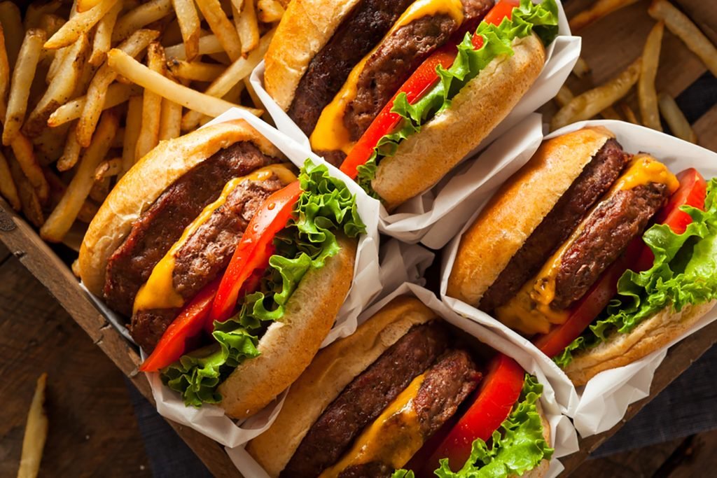Local twists to rapid meals with laksa burger and salted egg fried fowl
